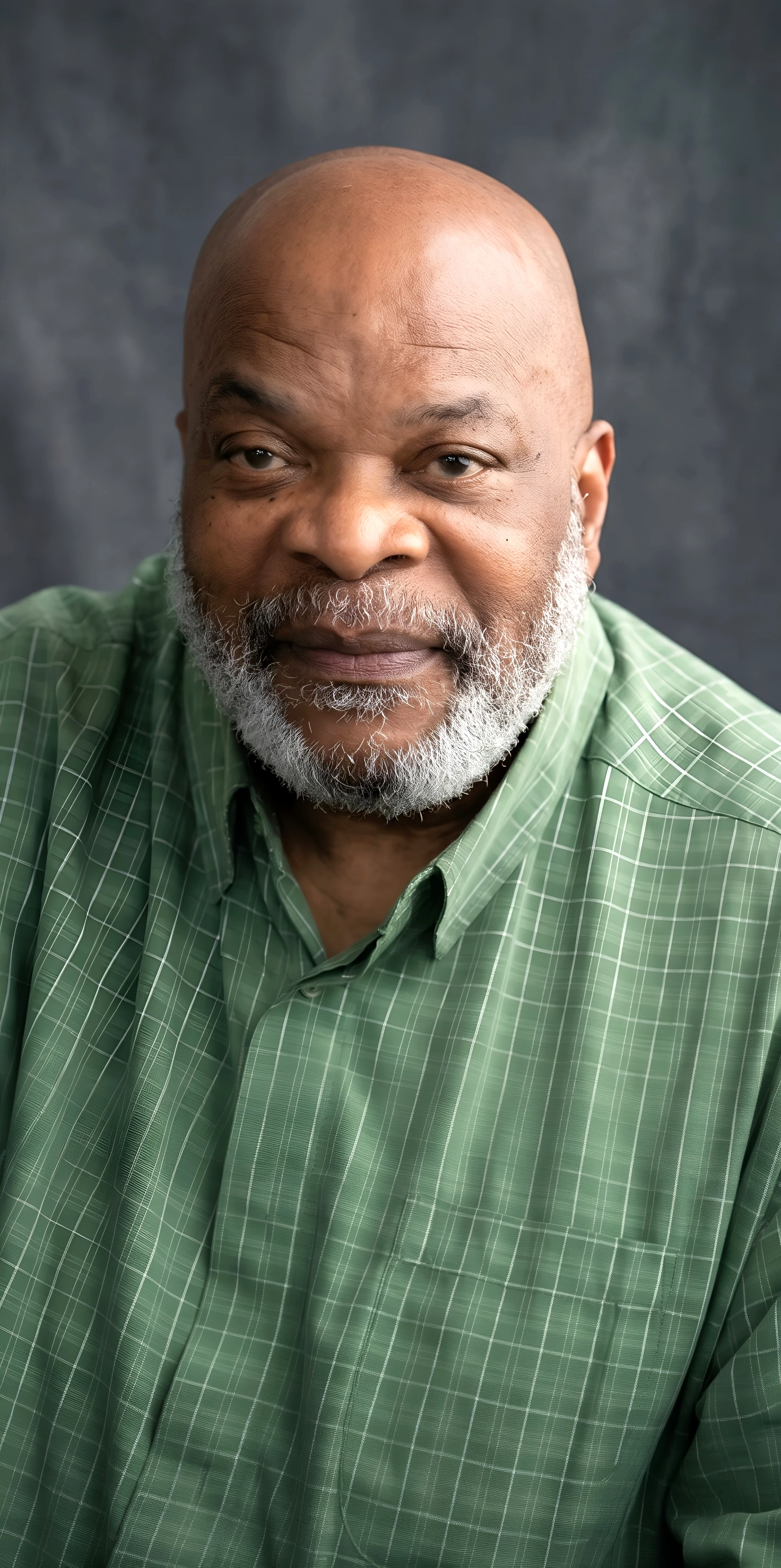 Editorially modified portrait of longtime committee member Isa Ali Avery wearing a green patterned shirt.